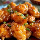 ORANGE CHICKENIngredients:1 lb boneless, skinless chicken breasts, cut into bite-sized pieces1 cup cornstarch2 eggs, beaten1/4 cup soy sauce1/4 cup orange juice1/4 cup sugar2 tbsp rice vinegar1 tbsp cornstarch mixed with 2 tbsp water2 cloves garlic, minced1 tbsp grated ginger2 cups vegetable oil for fryingDirections:1. Coat Chicken: Dredge chicken pieces in cornstarch, then dip in beaten eggs.2. Fry Chicken: Heat vegetable oil in a large skillet over medium-high heat. Fry chicken pieces until golden brown and crispy. Remove and drain on paper towels.3. Make Sauce: In a saucepan, combine soy sauce, orange juice, sugar, rice vinegar, garlic, and ginger. Bring to a boil. Add cornstarch mixture and cook until thickened.4. Combine: Toss fried chicken pieces in the sauce until well coated.