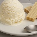 Vanilla Ice CreamIngredients• 1 cup heavy cream• 1 cup whole milk• ½ cup granulated sugar• 2 tsp vanilla extractInstructions1. In a medium saucepan, combine the milk, cream, and sugar.2. Heat over medium flame until the sugar dissolves completely (do not boil).3. Remove from heat and stir in vanilla extract.4. Let the mixture cool to room temperature, then refrigerate for at least 2–3 hours.5. Pour the chilled mixture into an ice cream maker and churn according to the manufacturer’s directions.6. Transfer to a container and freeze for 4–6 hours or until firm.