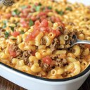 Easy Taco MacIngredients:▢ 1 lb ground beef or ground turkey▢ 1 box macaroni and cheese (prepared as directed)▢ 1 can Rotel (diced tomatoes with green chilies)▢ 1 packet taco seasoningInstructions:1. In a skillet, cook ground beef over medium heat until browned. Drain excess grease.2. Add taco seasoning and Rotel (undrained). Simmer for 5 minutes.3. Prepare macaroni and cheese in a separate pot as per package directions.4. Mix the prepared mac and cheese with the taco meat mixture.5. Serve warm