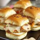 Turkey SlidersIngredients8 slider buns1/4 cup mayonnaise2 tablespoons Dijon mustard2 teaspoons dill pickle relish, drained8 dill pickle slices8 thin slices deli turkey8 thin slices Swiss cheese2 tablespoons unsalted butter, melted1 teaspoon Worcestershire sauce1 teaspoon everything bagel seasoning, or to tasteDirectionsPreheat the oven to 350 degrees F 165 degrees C. Line a baking sheet with parchment paper.Using a serrated knife, slice slider buns in half horizontally, and set tops aside.In a small bowl, stir together mayonnaise, Dijon mustard, and pickle relish.Spread the dressing on the bottom halves of the buns, and place a pickle slice on top of each.  Put a half slice of turkey on each, folding to fit. Top with Swiss cheese, again either folding or cutting to fit, and place the remaining half of the turkey slices on top of the cheese. Place the tops of the buns on the sandwiches.Place sliders on the prepared baking sheet. Stir together melted butter and Worcestershire. Brush slider buns with butter, and sprinkle with everything seasoning. Cover with foil.Bake in the preheated oven until cheese begins to melt, 12 to 15 minutes. Remove the foil, and bake until buns are golden, about 3 minutes. Cool for about 3 minutes, and serve warm.